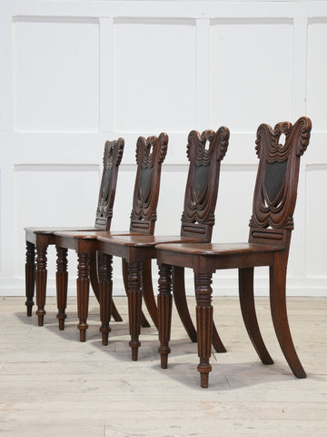 A Set of Four Regency Shield Back Oak Hall Chairs