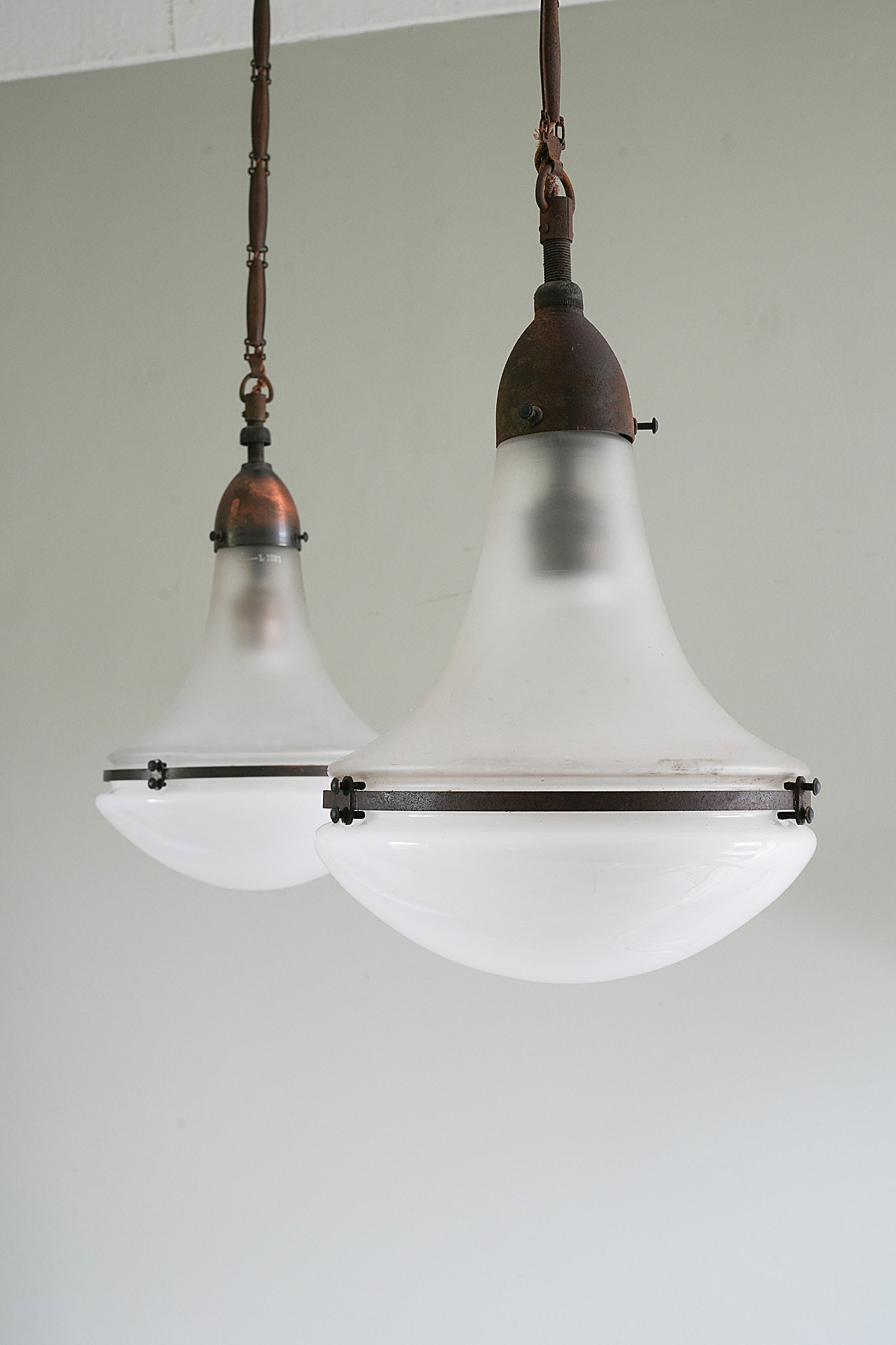 A Pair “Luzette” Pendant Light by Peter Behrens