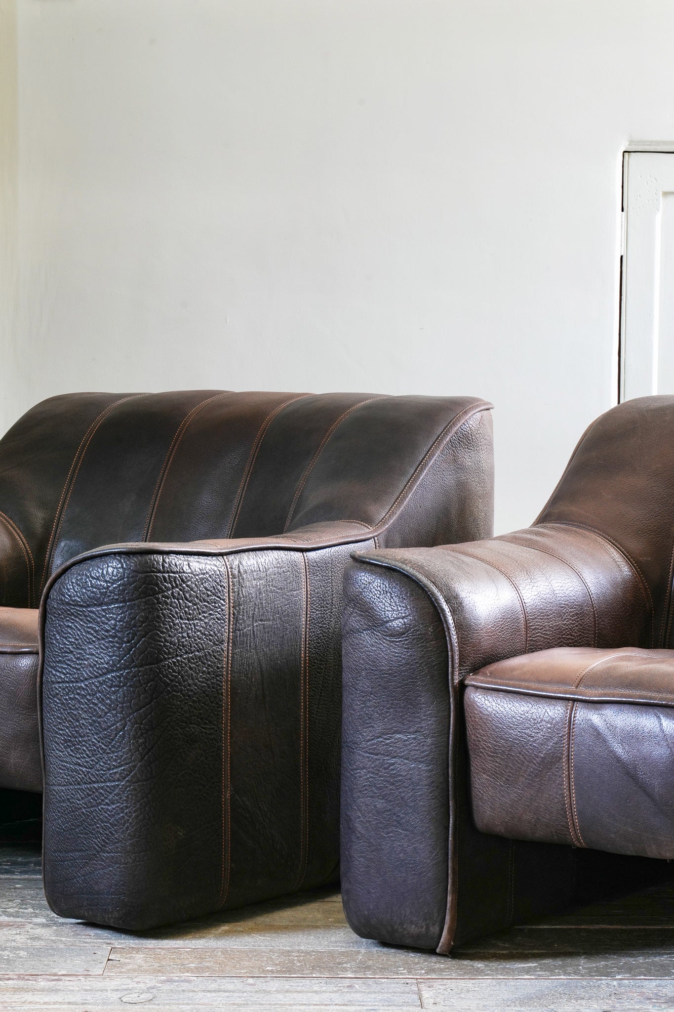 A Pair of Buffalo Leather De Sede DS 44 Armchairs