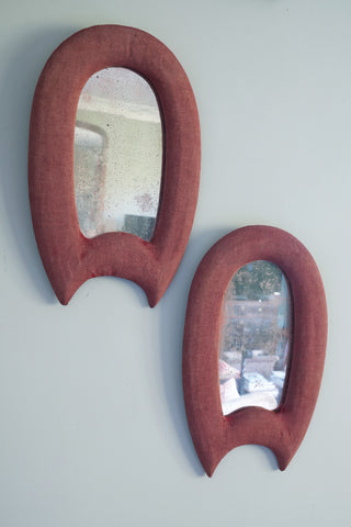 A Pair of Red Velvet Wall Mirrors