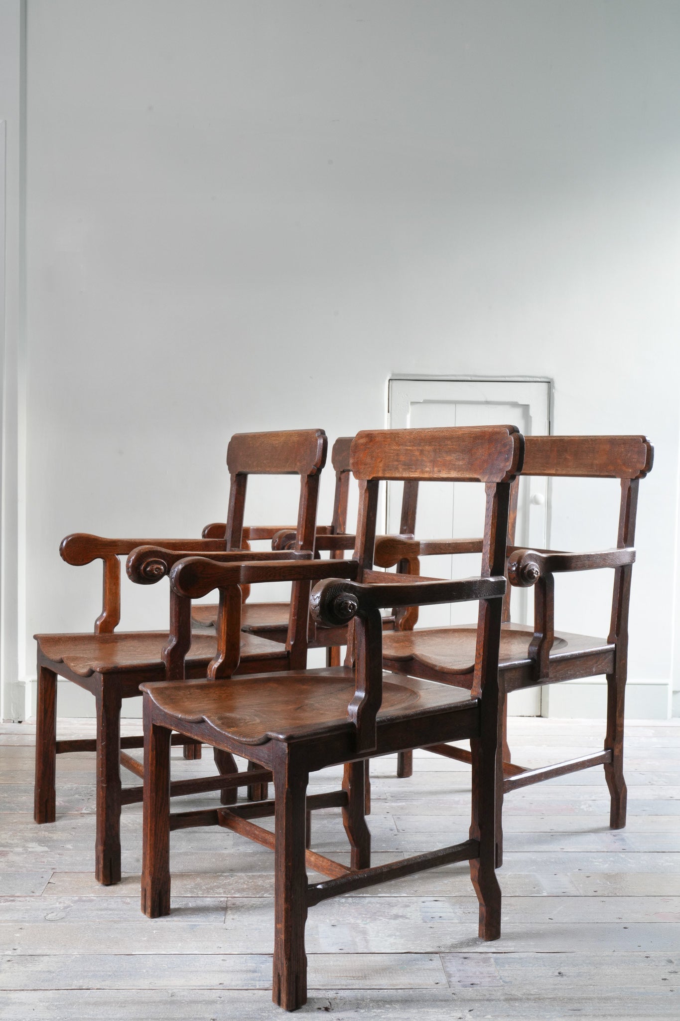 A Set Of Four Oak Armchairs