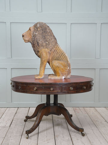 A Painted Plaster Seated Lion