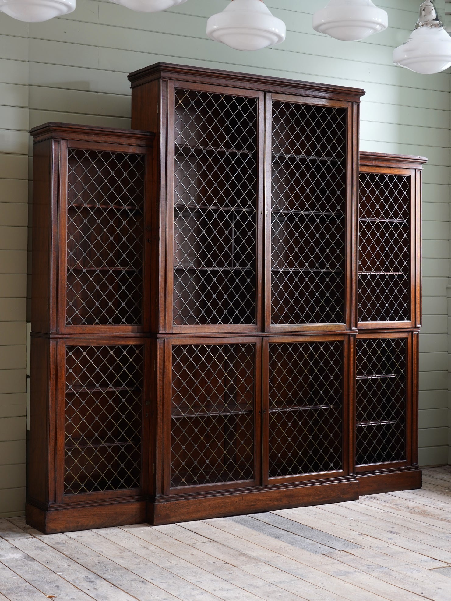 A Regency Brass Mounted Mahogany Breakfront Bookcase