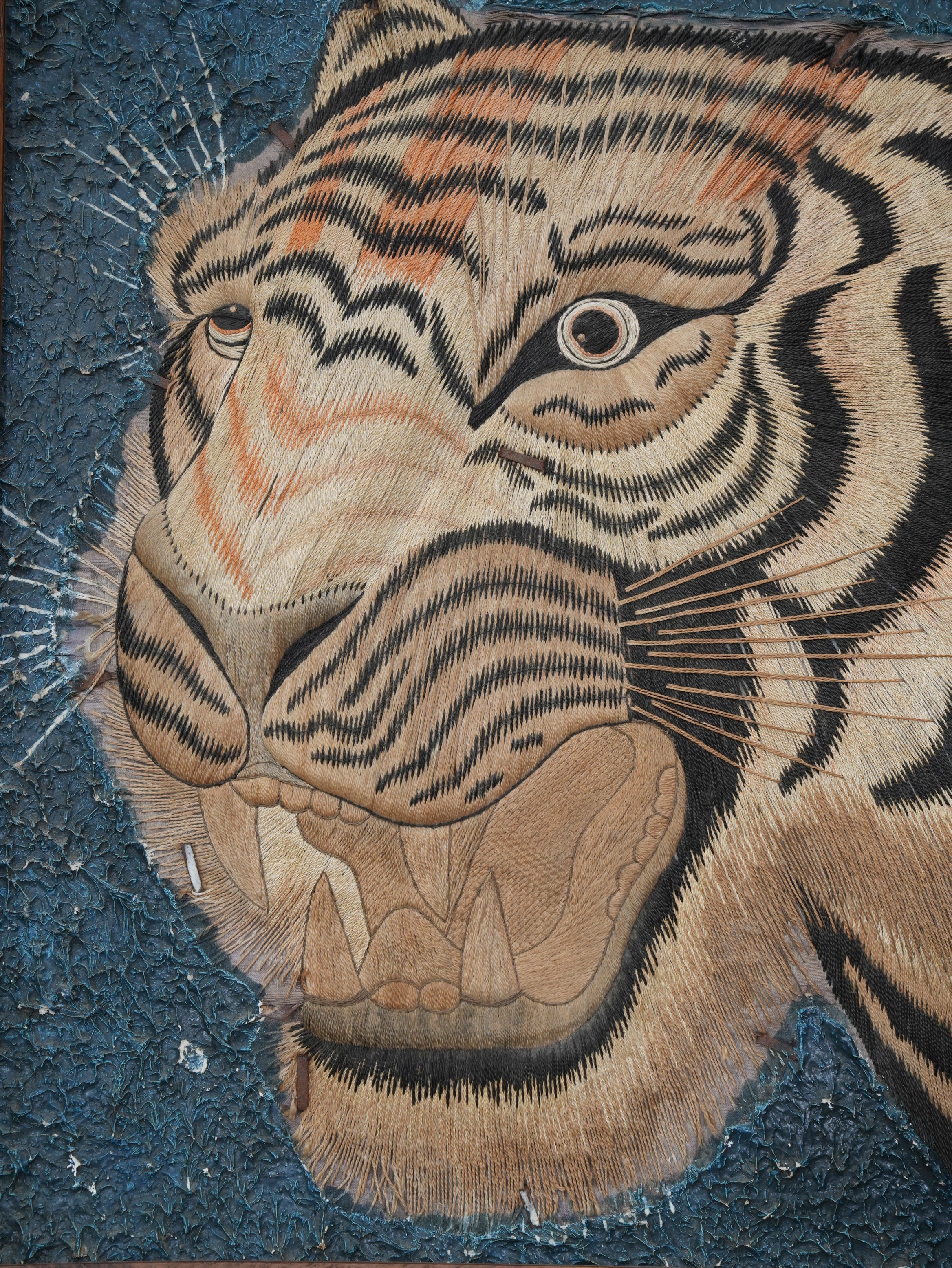 A Pair of Framed Silk Embroideries of Tigers Heads