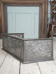 An Edwardian Pierced Steel Fireplace Fender