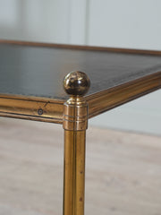 A Pair of Brass and Leather Side Tables