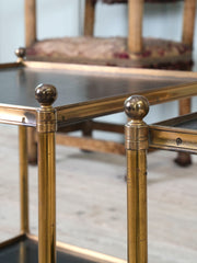 A Pair of Brass and Leather Side Tables