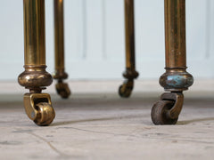 A Pair of Brass and Leather Side Tables