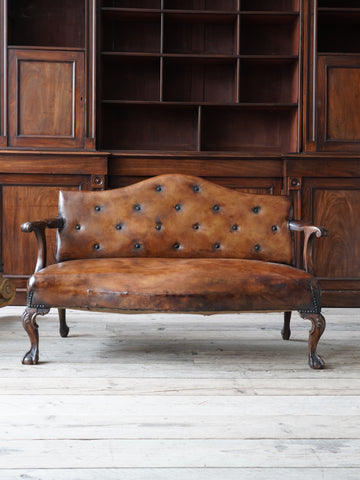 A Diminutive Leather Sofa