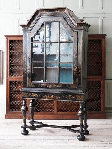 A 18th Century Chinoiserie Cabinet on Stand.