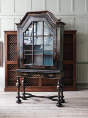 A 18th Century Chinoiserie Cabinet on Stand.