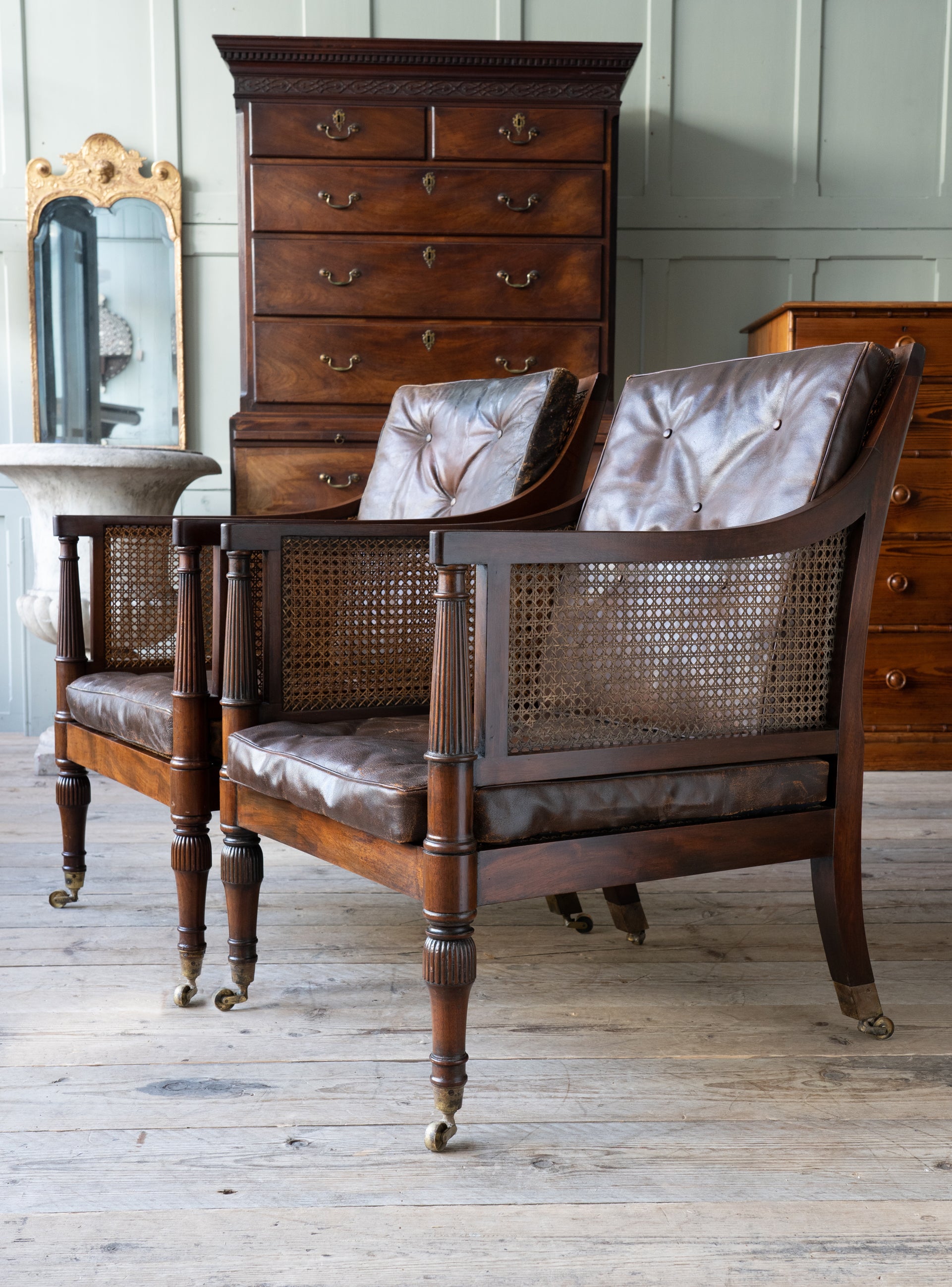 A Pair of Caned Regency Armchairs